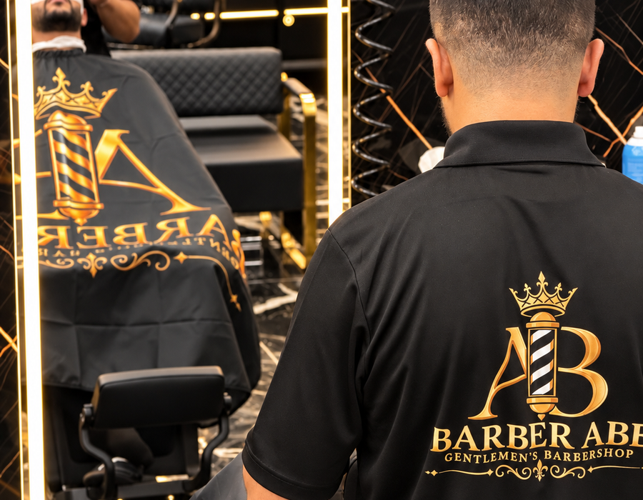 Father and son getting haircuts at Barber Abe